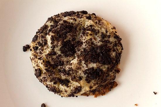 Overhead image of one Oreo cheesecake cookie on a white plate.