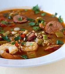 Shrimp and sausage jambalaya in a white bowl.