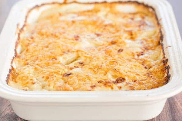 Scalloped Potatoes - A classic dish and holiday staple! This easy homemade recipe comes together quickly and is wonderfully rich and cheesy.