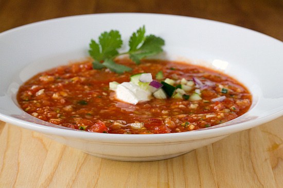 A serving of gazpacho in a white bowl.
