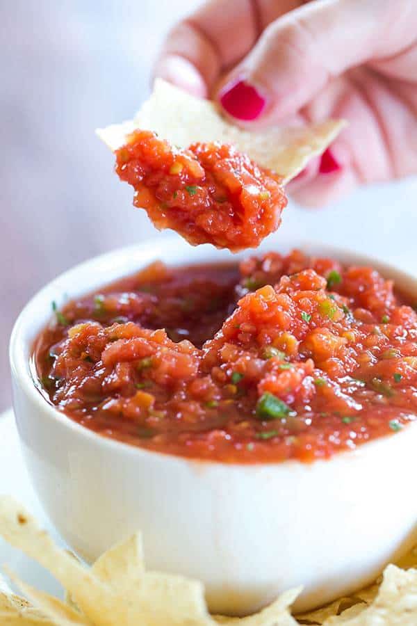 This Homemade Restaurant Style Salsa tastes like it came straight from your favorite Mexican restaurant, and it's ready in 10 minutes! Grab a bag of tortilla chips and get dipping!