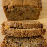 A loaf of zucchini pineapple bread sliced.