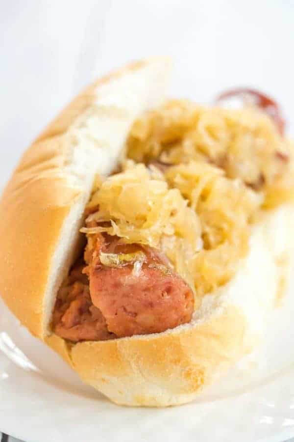 This slow cooker kielbasa and sauerkraut is flavorful and made with just the addition of beer and brown sugar - easy, delicious and perfect for parties!