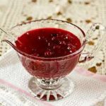 Cranberry sauce in a glass serving bowl.
