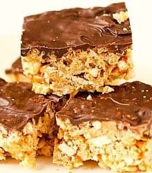 A stack of chubby hubby Rice Krispie treats topped with a layer of chocolate.