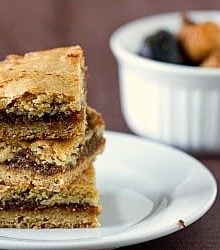 Stack of 3 fig bars on a white plate.
