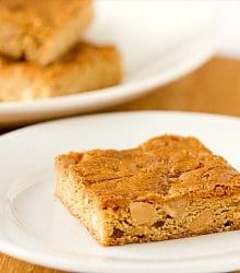 Peanut butter blondie on a white plate.