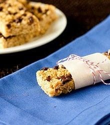 Chocolate chip granola bar wrapped in parchment paper and string.