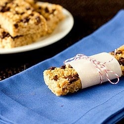 Chocolate chip granola bar wrapped in parchment paper and string.