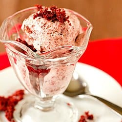Scoops of red velvet ice cream in a glass bowl.