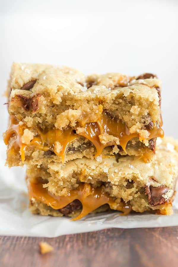 Salted Caramel Chocolate Chip Cookie Bars - A layer of salted caramel sauce is sandwiched between layers of a favorite chocolate chip cookie dough recipe, then topped with a sprinkle of fleur de sel.