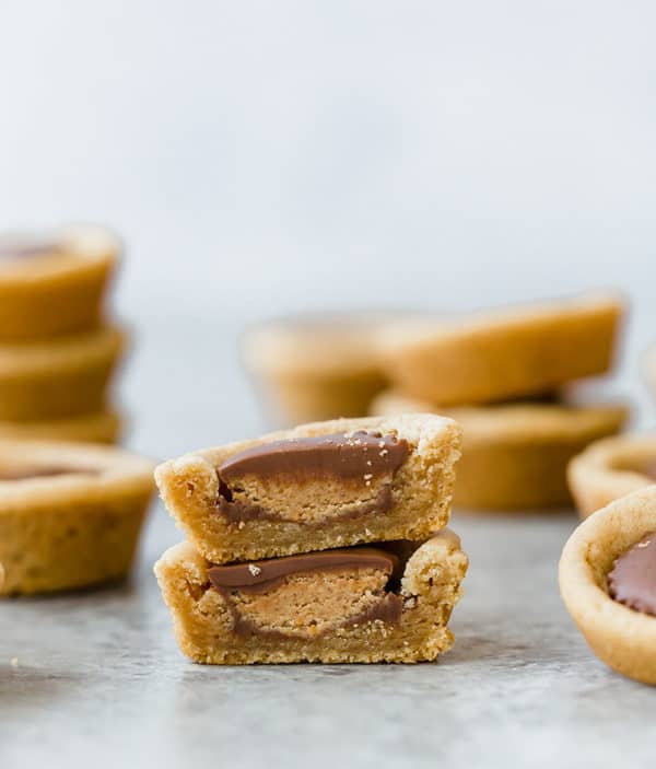 A peanut butter cup cookie cut in half and stacked.