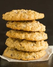 A big stack of five oatmeal chocolate chip cookies.