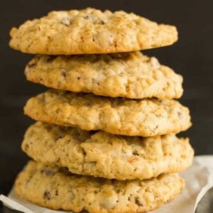 A big stack of five oatmeal chocolate chip cookies.
