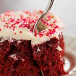 Red velvet cake is infused with sweetened condensed milk and topped with the best cream cheese frosting. A must for Valentine's Day!