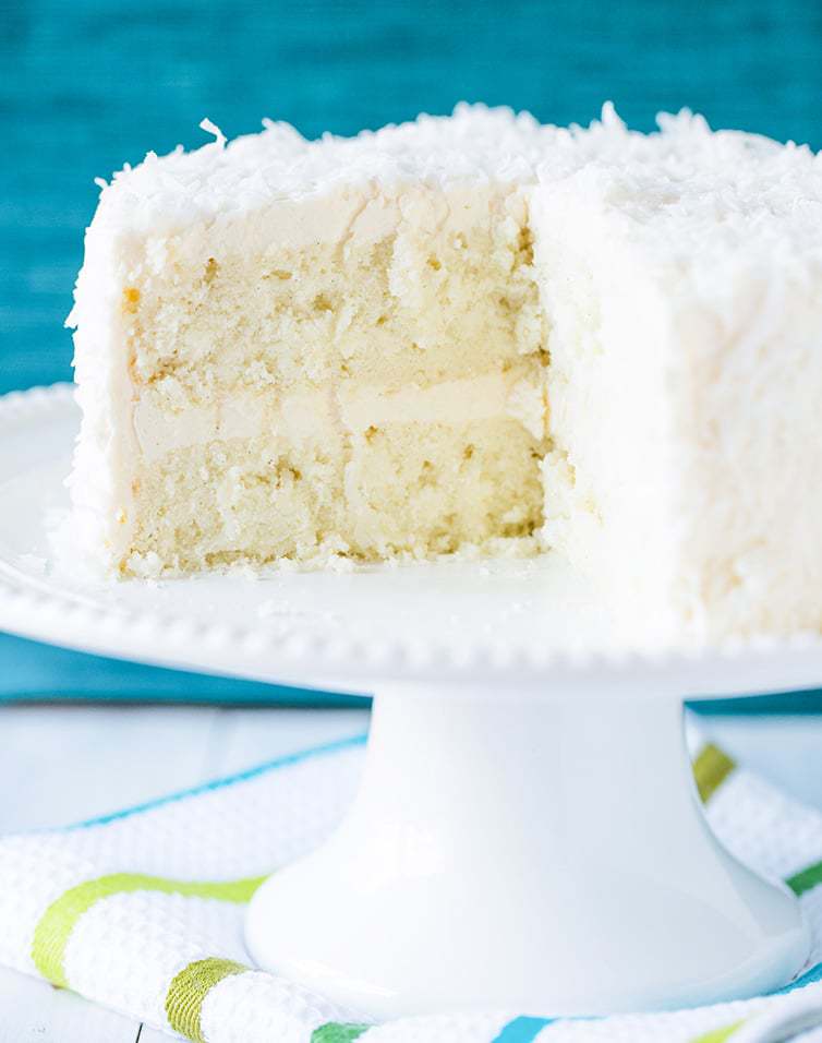 Coconut-Vanilla Bean Cake with Coconut Meringue Buttercream Frosting - A super moist coconut-packed layer cake and that frosting is a DREAM!
