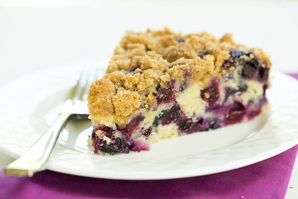 Blueberry Buckle Recipe on a white plate with a fork from @browneyedbaker :: www.browneyedbaker.com