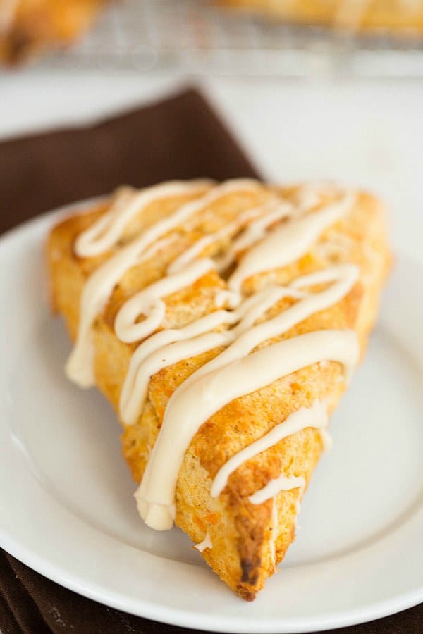 Sweet Potato Scones with Maple Cream Glaze by @browneyedbaker :: www.browneyedbaker.com