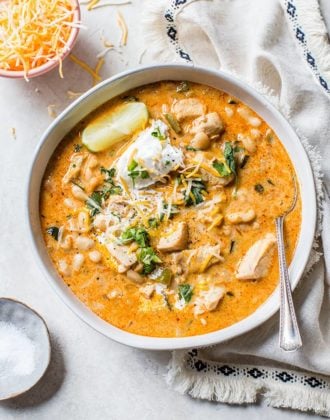 An overhead shot of a bowl of white chicken chili.