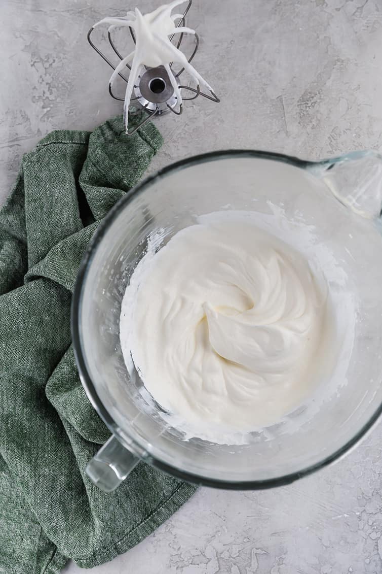 A mixing bowl with whipped cream.