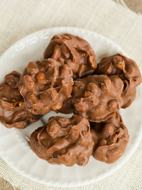 Crock-Pot Chocolate-Covered Peanut Clusters - SO easy and addictive! | browneyedbaker.com