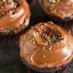 Chocolate cupcakes with a silky smooth chocolate frosting and sprinkles.