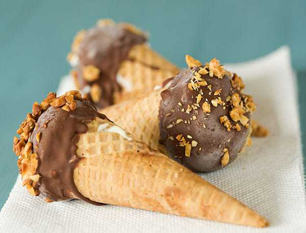 DIY: Homemade Drumsticks... Complete with a chocolate-coated sugar cone filled with vanilla ice cream, dipped in chocolate and rolled in peanuts! | browneyedbaker.com