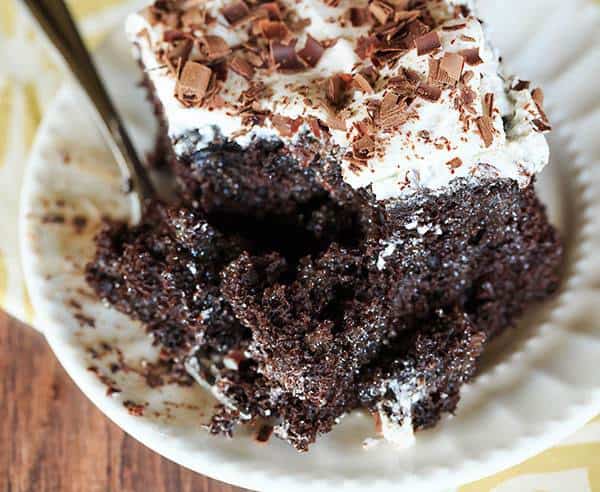 Mudslide Poke Cake - Chocolate cake infused with sweetened condensed milk, hot fudge, vodka, Kahlua and Baileys Irish Cream. An easy, delicious cake with a nice kick! | browneyedbaker.com