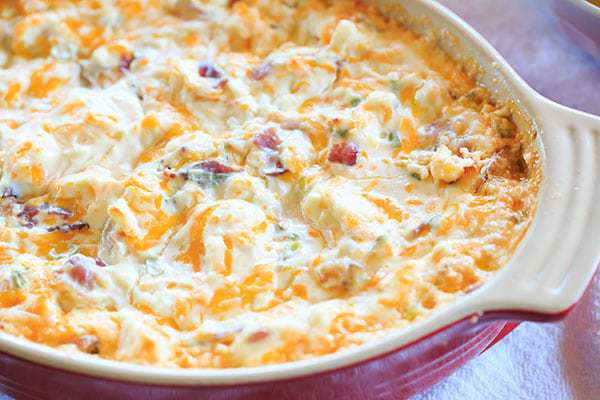 Warm and Cheesy Bacon Dip - A hot version of the popular Loaded Baked Potato Dip! | https://www.browneyedbaker.com/warm-cheesy-bacon-dip/