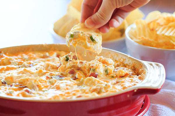 Warm and Cheesy Bacon Dip - A hot version of the popular Loaded Baked Potato Dip! | https://www.browneyedbaker.com/warm-cheesy-bacon-dip/