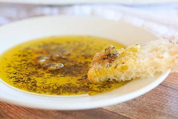 Roasted Garlic & Herb Dipping Oil - Perfect with a loaf of crusty Italian bread! | browneyedbaker.com