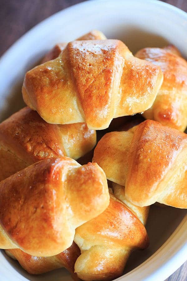 These homemade crescent rolls are flaky, buttery and easier than you'd think. They are the perfect accompaniment to any holiday meal! | https://www.browneyedbaker.com/homemade-crescent-rolls/