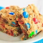 Monster Cookie Bars - Peanut butter dough is loaded with oats, chocolate chips and M&M's. | https://www.browneyedbaker.com/monster-cookie-bars/