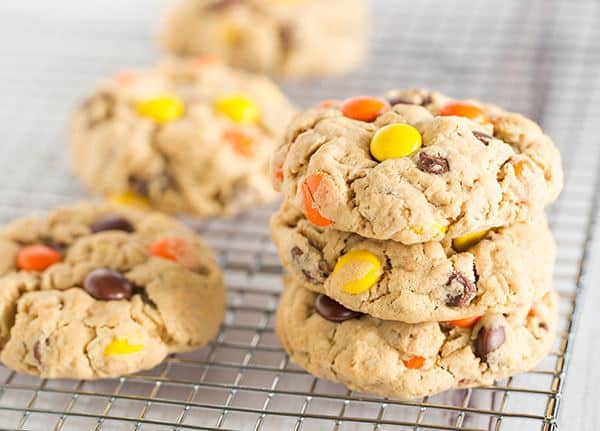 Peanut Butter Lover's Monster Cookies - A peanut butter dough loaded with oats, chocolate chips, peanut butter chips and Reese's Pieces! Go bake these NOW! | browneyedbaker.com