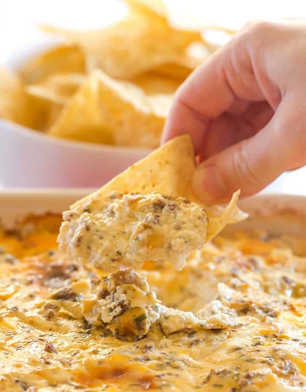 This "Hissy Fit Dip" with the crazy moniker is a HUGE party hit - sausage, cream cheese, sour cream, two cheeses, chives and seasonings make this one absolutely irresistible! | browneyedbaker.com