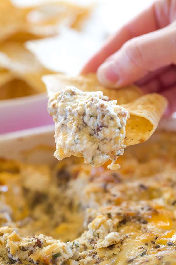 This "Hissy Fit Dip" with the crazy moniker is a HUGE party hit - sausage, cream cheese, sour cream, two cheeses, chives and seasonings make this one absolutely irresistible! | browneyedbaker.com