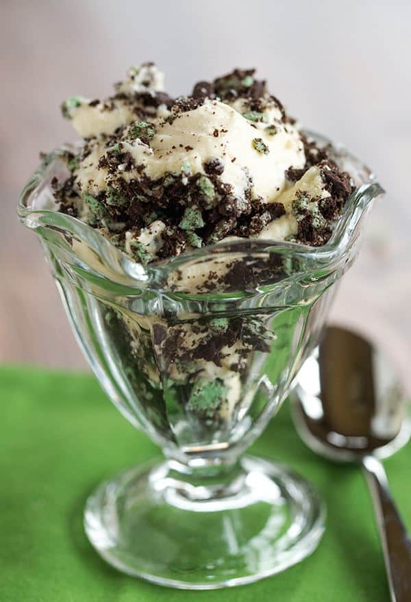 Baileys White Chocolate Mousse - Spiked white chocolate mousse layered into a trifle dish with crushed mint Oreos. An easy dessert for your St. Patrick's Day celebration!