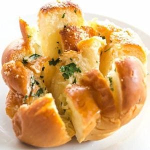 These Easy Pull-Apart Garlic Rolls are quick, a perfect way to use up leftover dinner rolls, and are a fabulous alternative to traditional garlic bread.