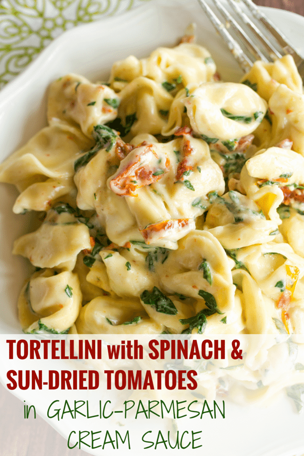 Tortellini in Parmesan-Cream Sauce with Spinach and Sun-Dried Tomatoes - An easy, AMAZING dinner ready in less than 30 minutes! Perfect for a weeknight meal or your next dinner party.