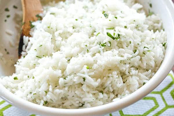 A copycat recipe for Chipotle's popular cilantro-lime rice, with a simple method to ensure light, fluffy rice with no clumps!