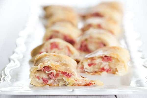 These reuben rolls feature pizza crust stuffed with corned beef, Swiss cheese, sauerkraut and a caraway-seed dressing. They will disappear in a matter of minutes!