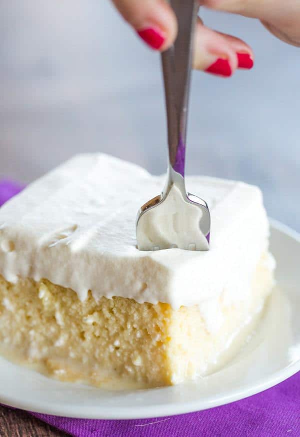 Tres Leches Cake - A simple recipe (no whipping egg whites!) for a super moist cake with the best whipped cream topping!