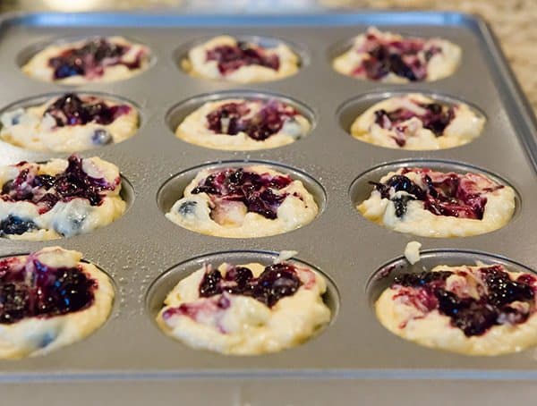 These blueberry muffins are loaded with fresh blueberries, have a fresh blueberry jam swirl throughout and are topped with sugar for a crunchy bite!