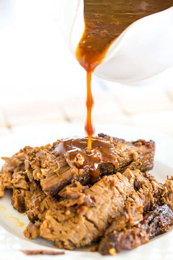 This slow cooker beef brisket is incredibly easy, cooks itself, and full of flavor thanks to the simple homemade barbecue sauce!