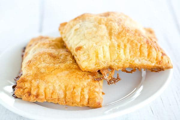 Banoffee Tartlets: A quick and easy dessert using puff pastry filled with chocolate, bananas and dulce de leche. All of the flavors of a banoffee pie without all of the work!