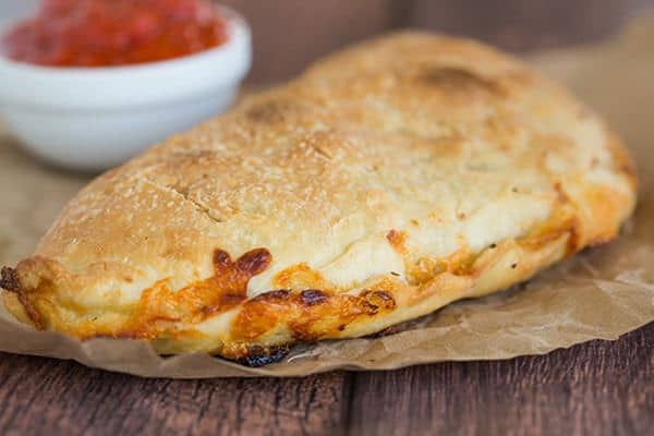 Simple, classic calzones made from an easy pizza dough and with an unlimited assortment of filling possibilities!