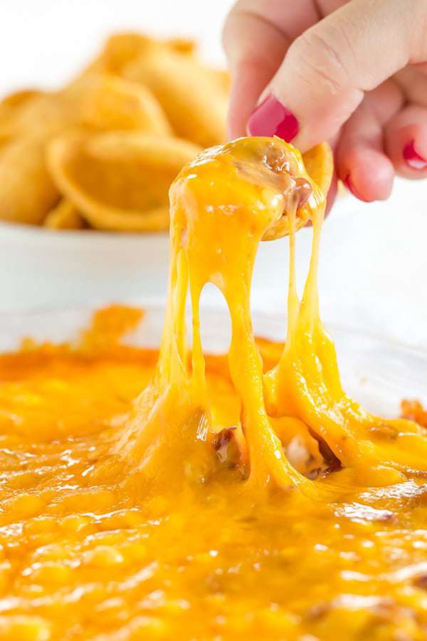 This Cheesy Chili Dip is incredibly easy and perfect for parties, cookouts or watching the game. Only THREE ingredients!!
