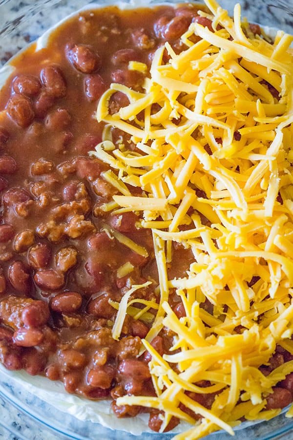 This Cheesy Chili Dip is incredibly easy and perfect for parties, cookouts or watching the game. Only THREE ingredients!! 