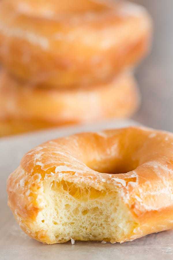 A copycat recipe for Krispy Kreme doughnuts - they're light, airy and covered in a barely-there glaze.