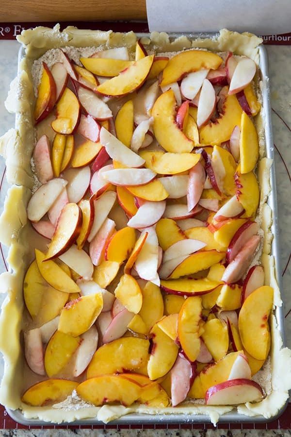 Nectarine Slab Pie - Homemade pie with a tender pastry crust and filled with both yellow and white nectarines. A summer must!